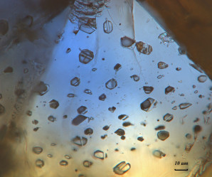 Fluid inclusions in a sapphire (Sutara deposit)